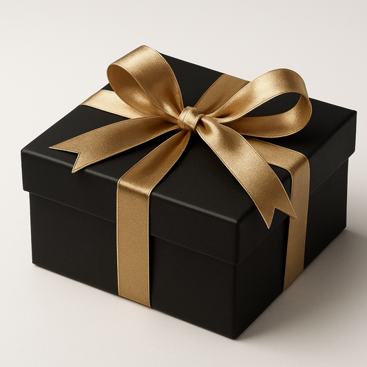 beautiful elegant neutral tone gift box using the colors white background, black gift ox with gold ribions